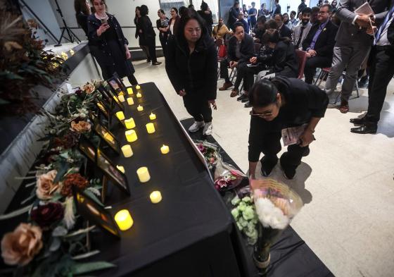 People attend a vigil for those murdered at the Lapu Lapu festival in Vancouver on the weekend at the Philippine Canadian Cultural Centre of Manitoba, Tuesday. (John Woods / Free Press)