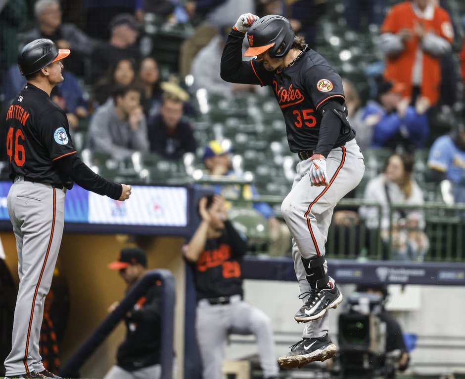 Baltimore Orioles' Adley Rutschman (35) reacts after scoring on his three-run home run during the 11th inning of a baseball game against the Milwaukee Brewers, Wednesday, May 21, 2025, in Milwaukee. (AP Photo/Jeffrey Phelps)