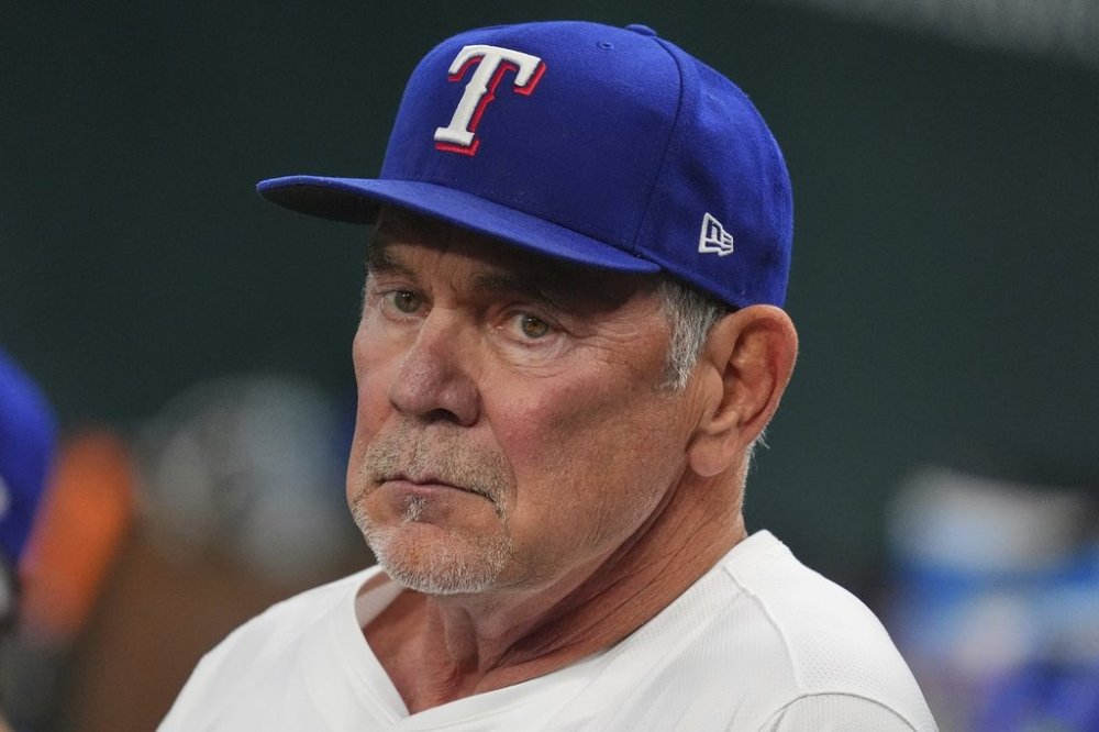 Texas Rangers manager Bruce Bochy sits in the dugout before a baseball game against the Houston Astros, Thursday, May 15, 2025, in Arlington, Texas. (AP Photo/LM Otero)