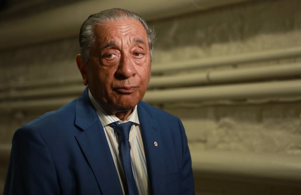 Former B.C. Attorney General Wally Oppal answers questions from reporters during a scrum in Victoria, B.C., on July 19, 2023. THE CANADIAN PRESS/Chad Hipolito