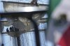A Mexican flag is displayed on a fence near the Cuauhtemoc, a masted Mexican Navy training ship, after it collided with the Brooklyn Bridge in New York, Monday, May 19, 2025. (AP Photo/Seth Wenig)