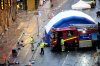 Police and emergency personnel walk next to a tent at the site of an incident on Water Street near the Liver Building in Liverpool after a car collided with pedestrians during the Premier League winners parade, in Liverpool, England, Monday May 26, 2025. (Danny Lawson/PA via AP)