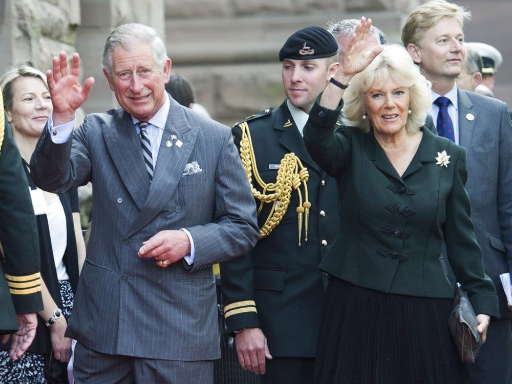 Prince Charles and his wife Camilla wave as they arrive at Queen's Park as the royal couple celebrate the 60th Queen's Diamond Jubilee anniversary in Toronto on Tuesday, May 22, 2012. THE CANADIAN PRESS/Nathan Denette