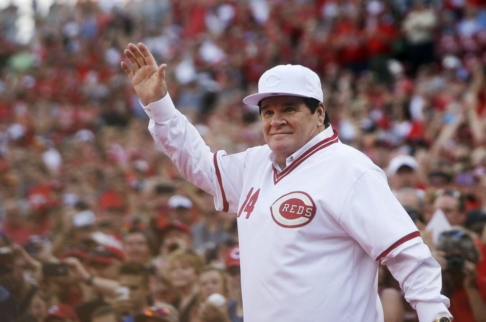 FILE - In this June 24, 2016, file photo, former Cincinnati Red Pete Rose waves to the crowd as he is introduced on the field during a ceremony to honor the 1976 World Series champions team, before the Reds' baseball game against the San Diego Padres in Cincinnati. (AP Photo/John Minchillo, File)