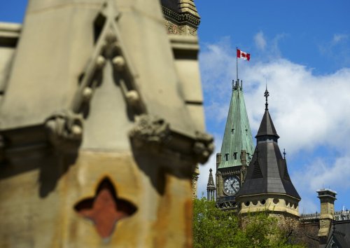 The Peace Tower on Parliament Hill is pictured from the West Gate in Ottawa on Monday, May 6, 2024. THE CANADIAN PRESS/Sean Kilpatrick
