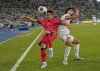 South Korea's Lee Taeseok, left, fights for the ball with Irag's Youssef Amyn (7) during the Asian qualifier group B soccer match for 2026 World Cup between South Korea and Iraq at the Basra International Stadium, in Basra, Iraq, Thursday, June 5, 2025. (AP Photo/Hadi Mizban)