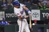 Texas Rangers' Josh Jung hits a home run during the first inning of a baseball game against the Colorado Rockies, Tuesday, May 13, 2025, in Arlington, Texas. (AP Photo/LM Otero)