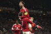 Manchester United's Mason Mount (7) celebrates with Bruno Fernandes after scoring their first goal of the game during the Europa League semifinal second leg soccer match between Manchester United and Athletic Bilbao in Manchester, Britain, Thursday, May 8, 2025. (Martin Rickett/PA via AP)