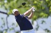 Shane Lowry, of Ireland, hits on the first hole during the third round of the Truist Championship golf tournament at the Philadelphia Cricket Club, Saturday, May 10, 2025, in Flourtown. (AP Photo/Matt Rourke)