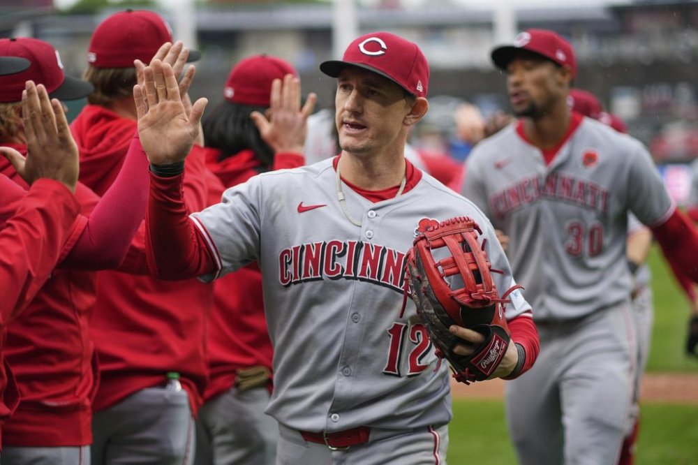 Cincinnati Reds' Austin Hays celebrates with teammates after their baseball game against the Kansas City Royals, Monday, May 26, 2025, in Kansas City, Mo. (AP Photo/Charlie Riedel)