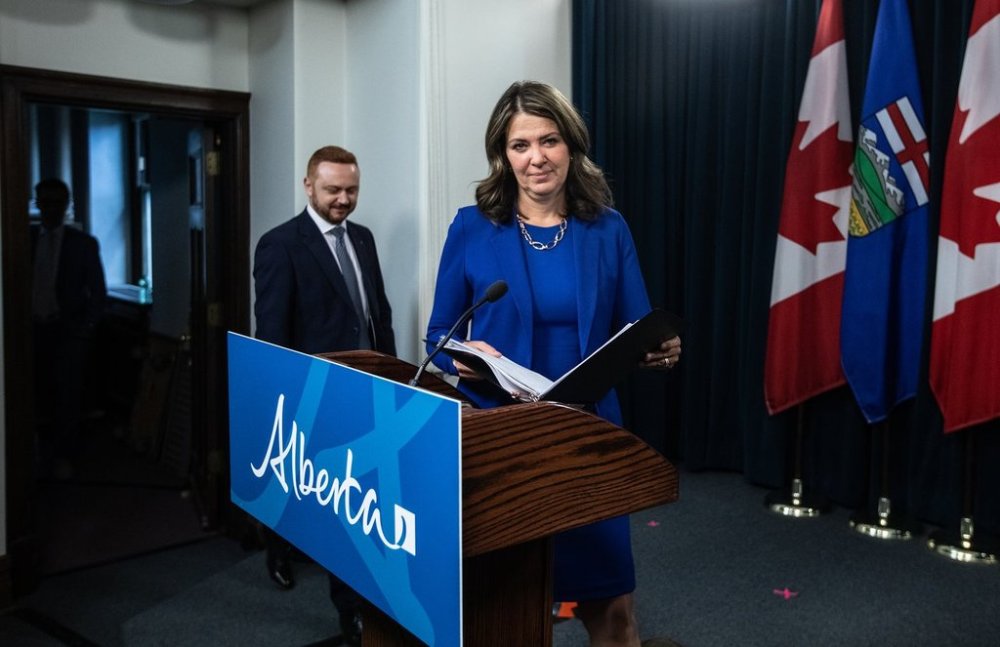 Alberta Premier Danielle Smith and Minister of Justice Mickey Amery make their way to announce proposed changes to several pieces of democratic process legislation, in Edmonton on April 29, 2025. THE CANADIAN PRESS/Jason Franson