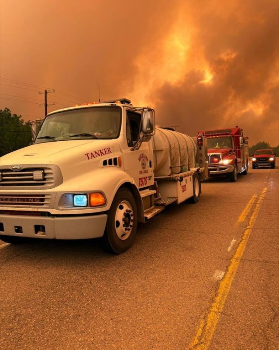 A Buckland Fire and Rescue tanker truck on a highway after being deployed to La Ronge, Sask. (Buckland Fire and Rescue / Supplied / The Canadian Press)