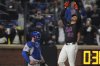 New York Mets' Juan Soto (22) gestures as he passes Chicago Cubs catcher Carson Kelly after hitting a home run during the fourth inning of a baseball game Friday, May 9, 2025, in New York. (AP Photo/Frank Franklin II)