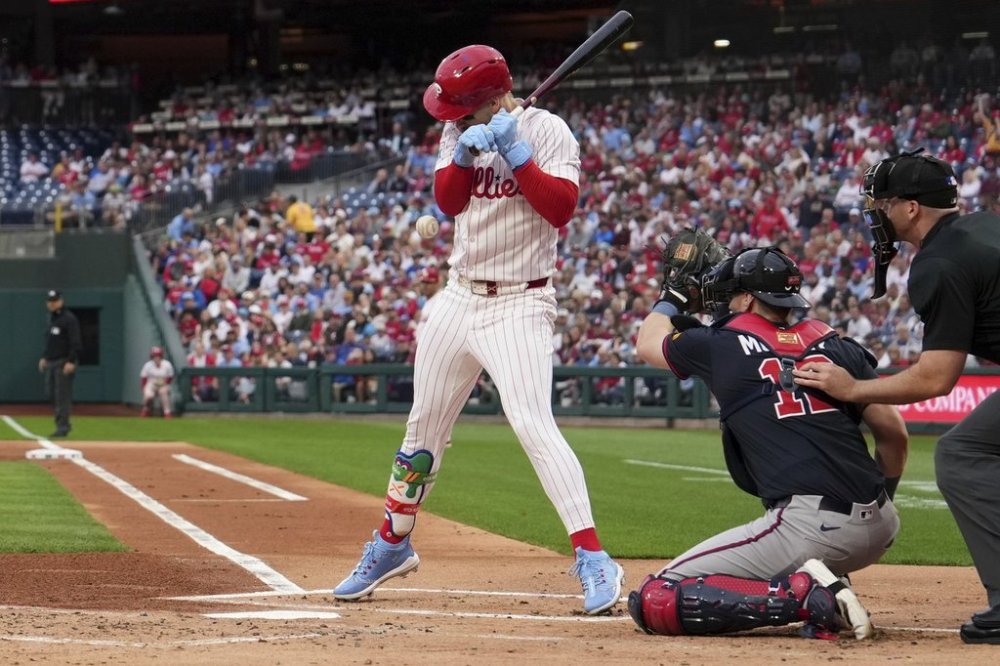 Philadelphia Phillies' Bryce Harper is hit by a pitch from Atlanta Braves' Spencer Strider during the first inning of a baseball game Tuesday, May 27, 2025, in Philadelphia. (AP Photo/Matt Slocum)