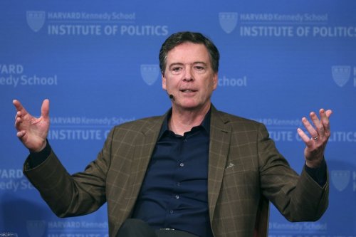 FILE - Former FBI director James Comey gestures while speaking at Harvard University's Institute of Politics' JFK Jr. Forum in Cambridge, Mass., Feb. 24, 2020. (AP Photo/Charles Krupa, File)