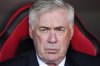 Real Madrid's head coach Carlo Ancelotti waits for the start of a Spanish La Liga soccer match between Sevilla and Real Madrid at the Ramon Sanchez Pizjuan stadium in Seville, Spain, Sunday, May 18, 2025. (AP Photo/Jose Breton)