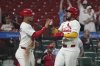 St. Louis Cardinals' Ivan Herrera, right and Willson Contreras celebrate after scoring during the seventh inning of a baseball game against the Detroit Tigers Monday, May 19, 2025, in St. Louis. (AP Photo/Jeff Roberson)