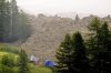 A large avalanche with a mixture of ice, rock, snow and water reach the valley floor is pictured in Wiler after the Birch glacier collapsing above Blatten, Switzerland, Wednesday, May 28, 2025. (Jean-Christophe Bott/Keystone via AP)