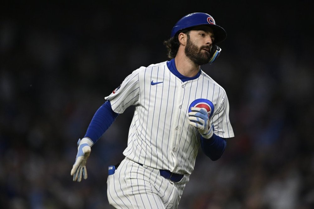 Chicago Cubs' Dansby Swanson rounds first base after hitting a two-run home run during the fifth inning of a baseball game against the Miami Marlins, Monday, May 12, 2025, in Chicago. (AP Photo/Paul Beaty)