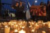 FILE - People gather to light candles in a makeshift memorial to honor Yaron Lischinsky and Sarah Milgrim who were killed as they left an event at the Capital Jewish Museum in Washington, during a candlelight vigil outside of the White House in Washington, Thursday, May 22, 2025. (AP Photo/Jose Luis Magana, file)