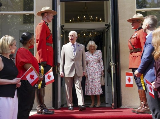 Britain's King Charles, centre left, and Queen Camilla leave after visiting the Canada House Trafalgar Square, in London, May 20. (Arthur Edwards / The Canadian Press / The Associated Press / Pool)