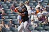 FILE - San Francisco Giants' Jerar Encarnacion hits against the Los Angeles Angels during a spring training baseball game, Monday, Feb. 24, 2025, in Tempe, Ariz. (AP Photo/Matt York,File)