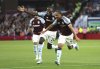Aston Villa's Boubacar Kamara, right, celebrates scoring their side's second goal of the game with team-mates during their English Premier League soccer match against Tottenham Hotspur at Villa Park, Birmingham, England, Friday, May 16, 2025. (Nick Potts/PA via AP)
