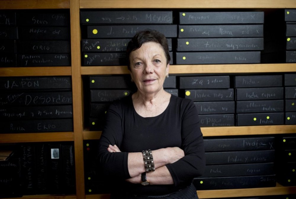 FILE - Mexican photographer Graciela Iturbide poses for a picture in front of her archived negatives during an interview with the Associated Press at her home in Mexico City, Wednesday, March 11, 2015. (AP Photo/Eduardo Verdugo, file)