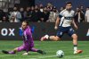 Vancouver Whitecaps' Brian White (24) scores on Austin FC's goalkeeper Brad Stuver (1) during the second half of an MLS soccer match in Vancouver, on Saturday, April 12, 2025. THE CANADIAN PRESS/Ethan Cairns
