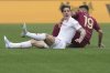 Roma's Zeki Celik, right and Fiorentina's Nicolo Zaniolo collide, during the Italian Serie A soccer match between Roma and Fiorentina at Rome's Olympic stadium, Italy, Sunday, May 4, 2025. (Alfredo Falcone/LaPresse via AP)