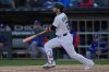 Chicago White Sox designated hitter Andrew Benintendi hits a two-run double during the sixth inning of a baseball game against the Texas Rangers, Saturday, May 24, 2025, in Chicago. (AP Photo/Erin Hooley)