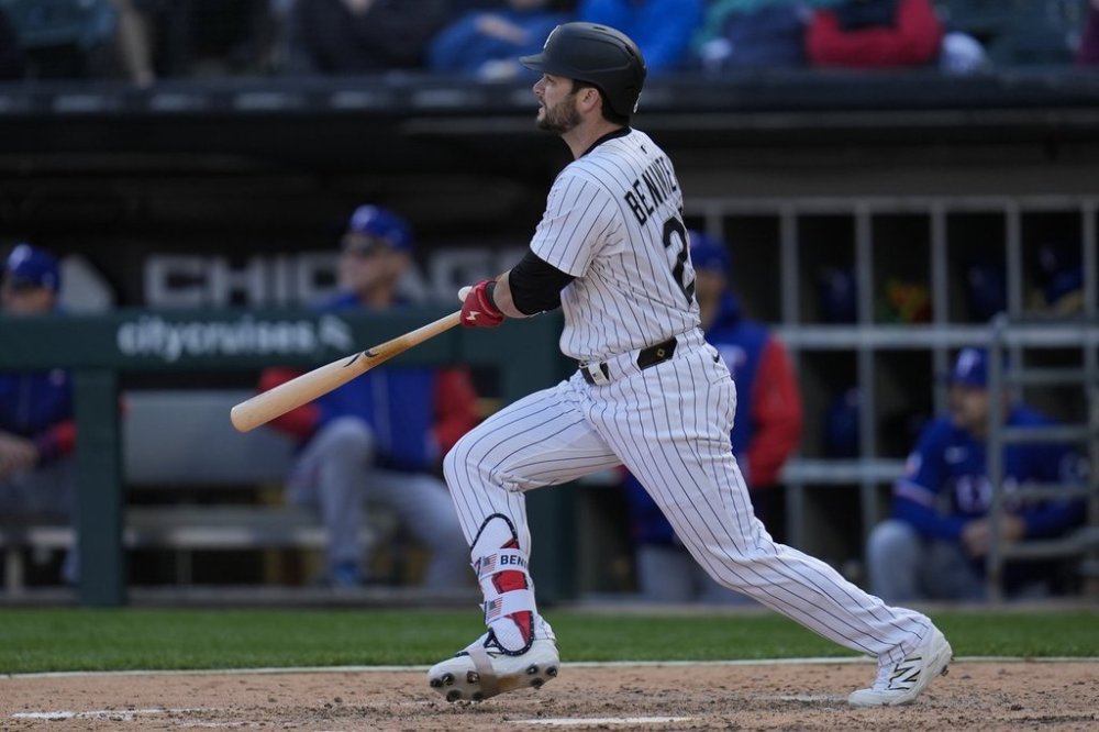 Chicago White Sox designated hitter Andrew Benintendi hits a two-run double during the sixth inning of a baseball game against the Texas Rangers, Saturday, May 24, 2025, in Chicago. (AP Photo/Erin Hooley)