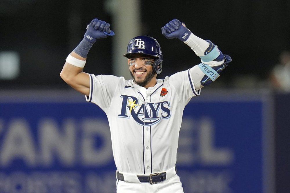 Tampa Bay Rays' José Caballero celebrates his two-run double off Minnesota Twins pitcher Kody Funderburk during the eighth inning of a baseball game Monday, May 26, 2025, in Tampa, Fla. (AP Photo/Chris O'Meara)