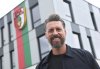 Sandro Wagner, new coach of FC Augsburg, stands in front of the FC Augsburg office, Wednesday, May 28, 2025. (Karl-Josef Hildenbrand/dpa via AP)