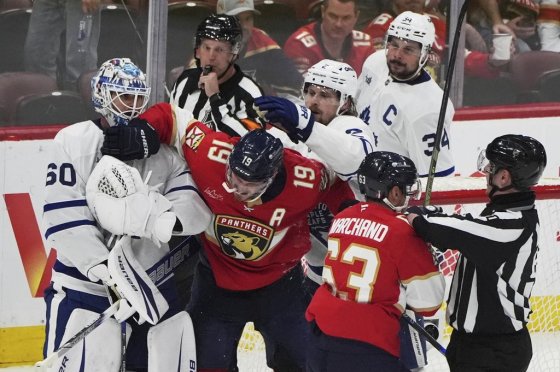 Florida Panthers forwards Matthew Tkachuk (19) and Brad Marchand (63) scuffle with Toronto Maple Leafs goaltender Joseph Woll (60) and defenceman Simon Benoit at the final buzzer on Friday, May 16, 2025, in Sunrise, Fla. (Lynne Sladky / The Associated Press files)