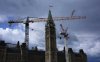 The Peace Tower on Parliament Hill in Ottawa is seen past construction cranes on Sunday, May 25, 2025. THE CANADIAN PRESS/Justin Tang