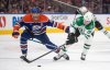 Dallas Stars' Mikko Rantanen (96) and Edmonton Oilers' Darnell Nurse (25) battle for the puck during third period NHL action in Edmonton on Wednesday, March 26, 2025. The Stars and Oilers will meet in the NHL's Western Conference final series. THE CANADIAN PRESS/Jason Franson