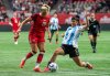 Argentina's Vanina Preininger (5) stops Canada's Adriana Leon (19) during the first half of an international friendly soccer match in Vancouver, on Friday, April 4, 2025. THE CANADIAN PRESS/Ethan Cairns