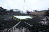 The tarp covers the infield as the baseball game between the Baltimore Orioles and Minnesota Twins was postponed due to weather, Tuesday, May 13, 2025, in Baltimore, and will be made up as part of a doubleheader Wednesday. (AP Photo/Nick Wass)
