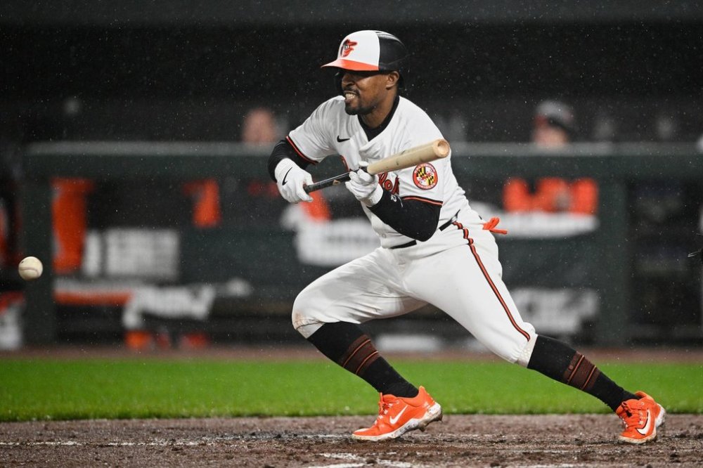 FILE - Baltimore Orioles' Tony Kemp bunts during a baseball game against the Kansas City Royals, Tuesday, April 2, 2024, in Baltimore. (AP Photo/Nick Wass, File)