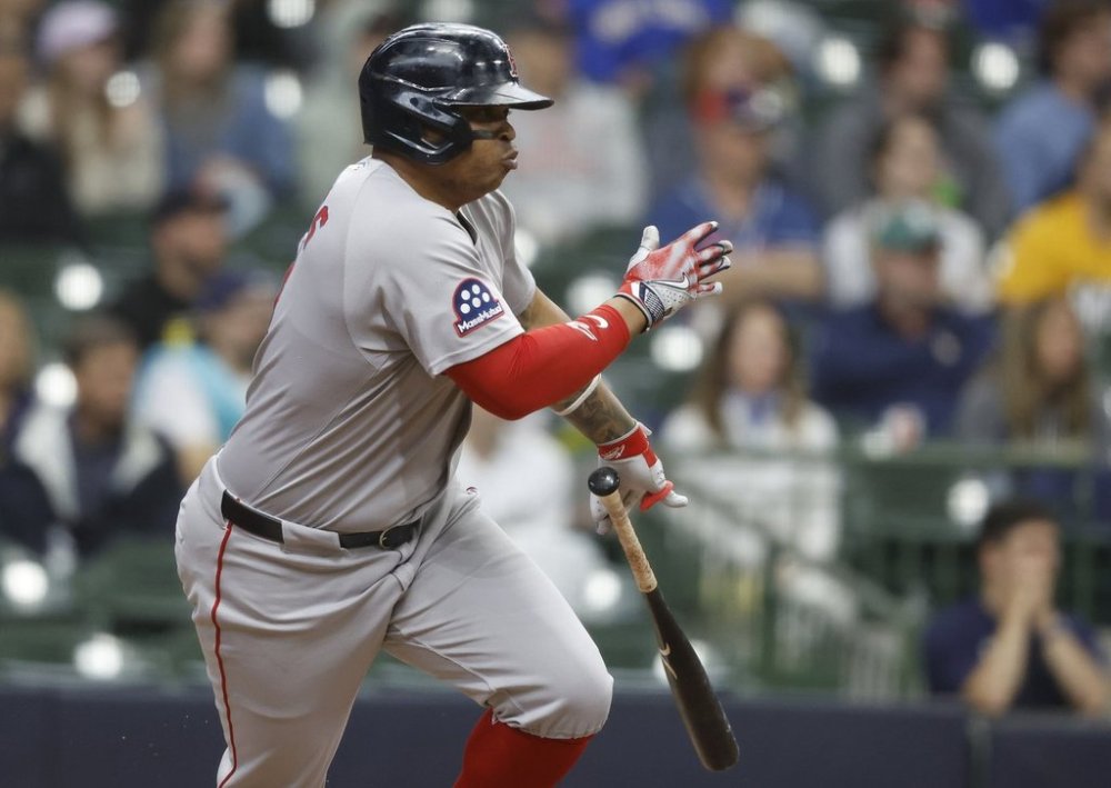 Boston Red Sox's Rafael Devers watches his two-RBI single during the fourth inning of a baseball game against the Milwaukee Brewers, Wednesday, May 28, 2025, in Milwaukee. (AP Photo/Jeffrey Phelps)