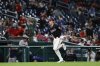 Washington Nationals' Robert Hassell III scores the game winning run on a single hit by Amed Rosario against Atlanta Braves pitcher Dylan Lee during the tenth inning of a baseball game in Washington, Thursday, May 22, 2025. (AP Photo/Terrance Williams)