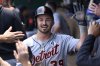 Detroit Tigers' Zach McKinstry is congratulated after scoring on a wild pitch during the third inning of a baseball game against the Kansas City Royals in Kansas City, Mo., Sunday, June 1, 2025. (AP Photo/Reed Hoffmann)