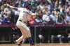 Seattle Mariners' Cal Raleigh watches his solo home run during the seventh inning of a baseball game against the Minnesota Twins, Sunday, Jun 1, 2025, in Seattle. (AP Photo/Ryan Sun)