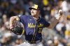 Milwaukee Brewers pitcher Tyler Alexander delivers during the seventh inning of a baseball game against the Pittsburgh Pirates Saturday, May 24, 2025, in Pittsburgh. (AP Photo/Matt Freed)