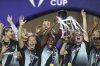 Players of NJ/NY Gotham FC of the U.S. lift the trophy after winning the CONCACAF Women Champions Cup tournament at University stadium in Monterrey, Mexico, Saturday, May 24, 2025. (AP Photo/Jorge Mendoza)