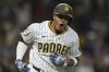 San Diego Padres' Manny Machado celebrates after hitting a home run during the fifth inning of a baseball game against the Chicago Cubs Tuesday, April 15, 2025, in San Diego. (AP Photo/Gregory Bull)