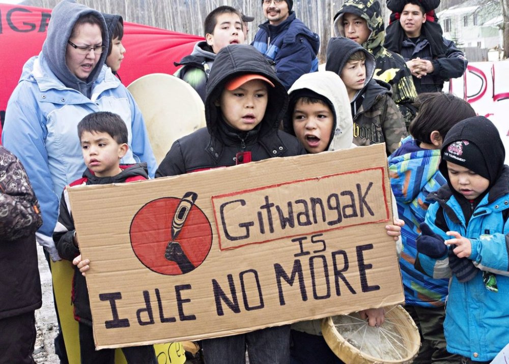 Members of the Gitxsan First Nation blockade a CN railroad track in Kitwanga, B.C., between Terrace and Smithers, on Wednesday, Jan. 16, 2013. THE CANADIAN PRESS/Robin Rowland