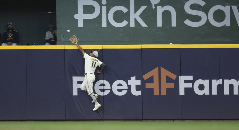 Milwaukee Brewers outfielder Jackson Chourio (11) catches a ball hit by Minnesota Twins' Royce Lewis during the eighth inning of a baseball game, Sunday, May 18, 2025, in Milwaukee. (AP Photo/Jeffrey Phelps)
