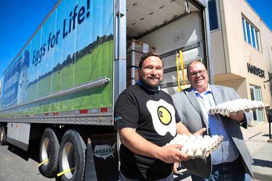 Manitoba Egg Farmers will double monthly egg donations to Harvest Manitoba amid what Harvest president & CEO Vince Barletta (left) says is record demand for food banks. Egg Farmers vice-chair Don Gaultier (right) says egg farmers are proud to be making a difference. (Ruth Bonneville / Free Press)